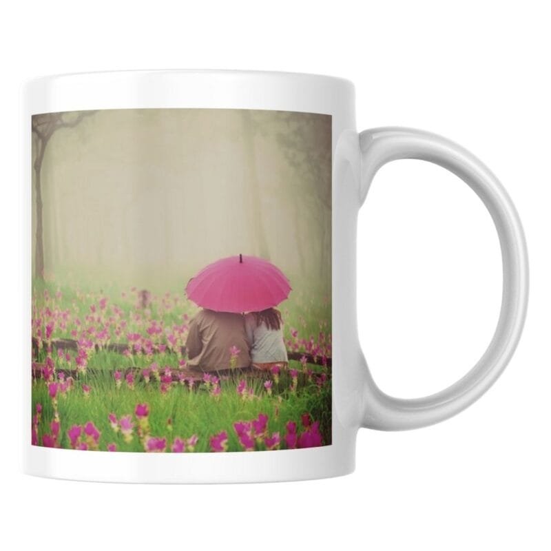 Romantic Couple Sitting Under Umbrella in Flower